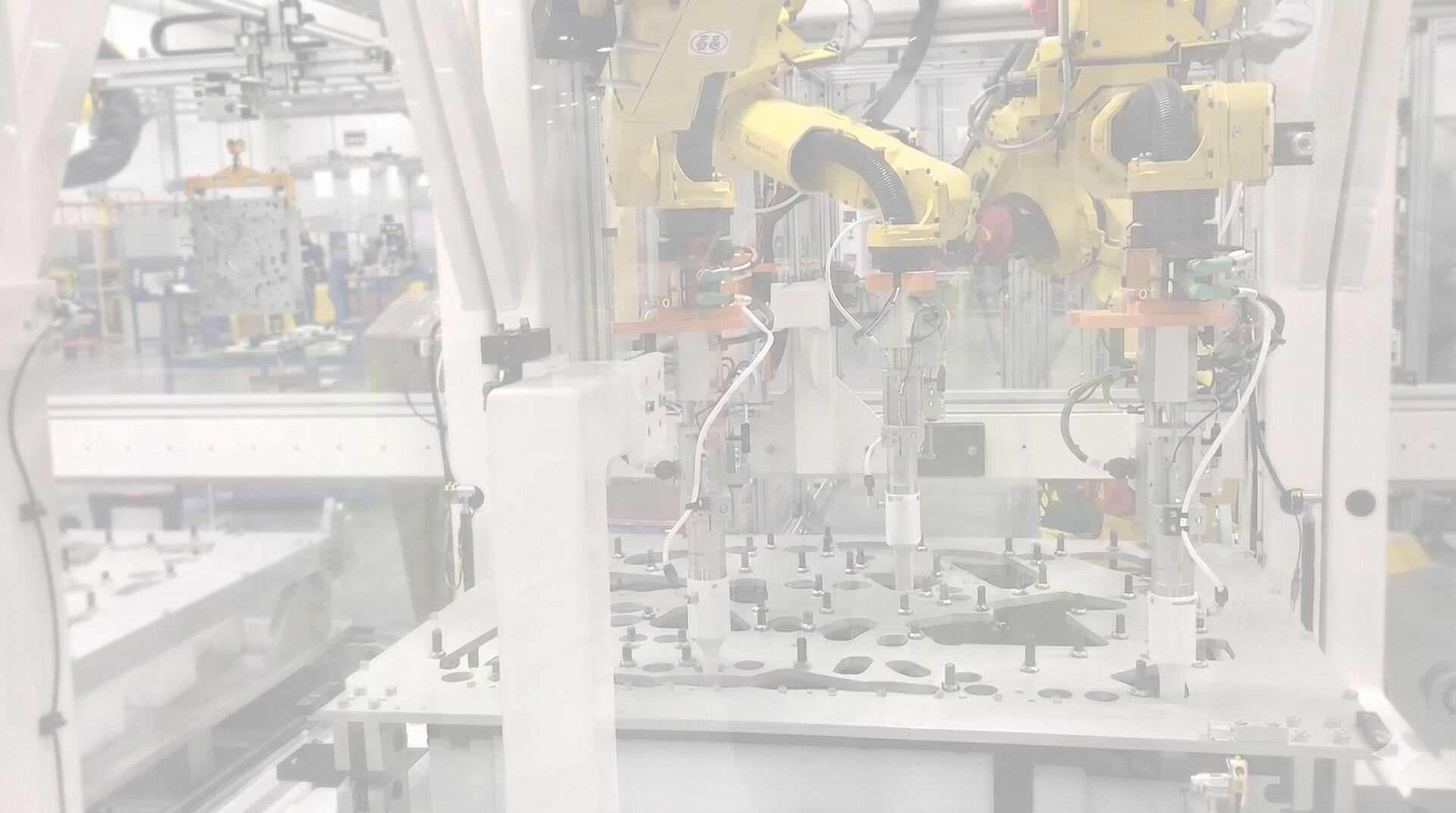 Industrial robots with ultrasonic welding modules processing parts in a cell