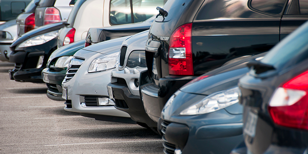 Row of parked cars in a parking lot